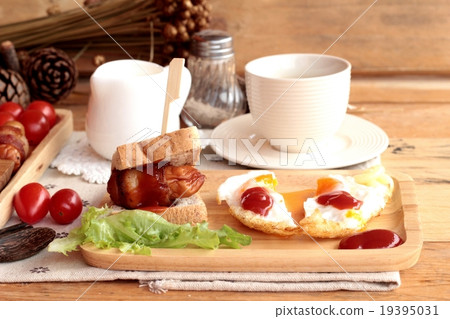 Grilled sausages wrapped in bacon fat delicious. Grilled sausages wrapped in bacon fat delicious. 19395031