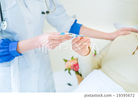 Professional nurse taking care of a patient  19395672