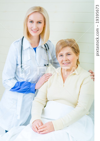 Professional nurse taking care of a patient  19395673
