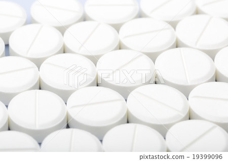 White pills on a white background White pills on a white background 19399096