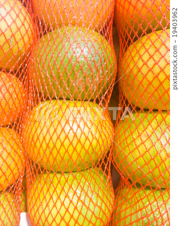 Fresh oranges in Mesh bag close up Fresh oranges in Mesh bag close up 19403962
