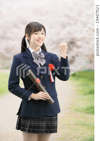 School girls in uniform in standing on cherry blossoms in full bloom School girls in uniform in standing on cherry blossoms in full bloom 19407621