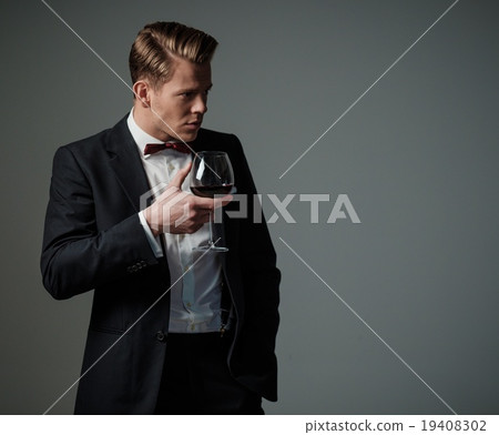 Sharp dressed man wearing jacket and bow tie 19408302