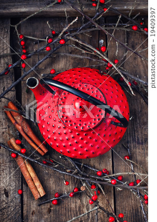 Kettle and branches with berries 19409397
