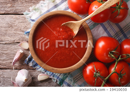 tomato sauce with garlic and basil in bowl closeup tomato sauce with garlic and basil in bowl closeup 19410030