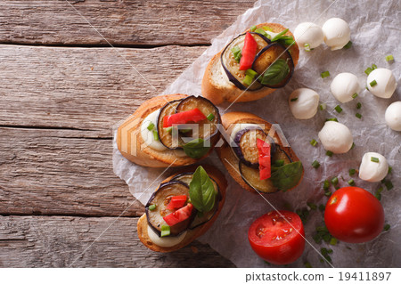 Sandwiches crostini with aubergine, tomato, cheese Sandwiches crostini with aubergine, tomato, cheese 19411897