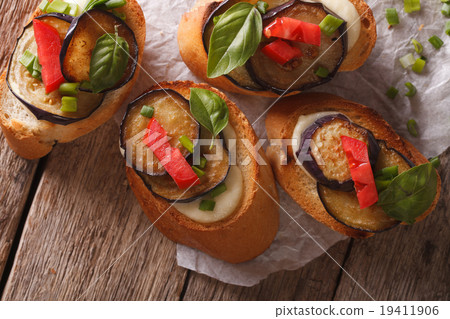 crostini with aubergine and mozzarella closeup crostini with aubergine and mozzarella closeup 19411906