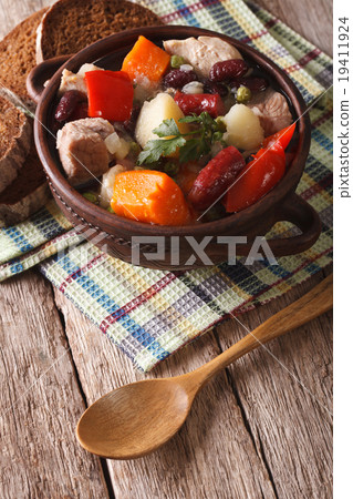 Traditional eintopf soup in the pot on the table 19411924