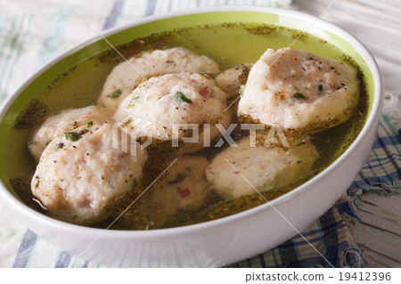 bread dumplings in a broth close up. horizontal 19412396