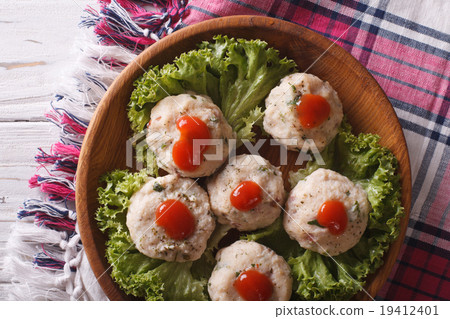 canederli with tomato sauce closeup on a plate canederli with tomato sauce closeup on a plate 19412401