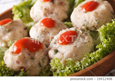 Italian canederli with tomato sauce on a plate 19412406