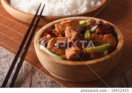 Kung pao chicken fillets in a bowl close up 19412425