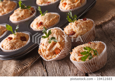 muffins with meat and cheese close-up on the table 19412883