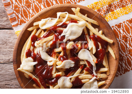 poutine - french fries with gravy and cheese 19412893
