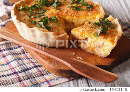 Homemade quiche Lorraine close-up cutting board 19413146