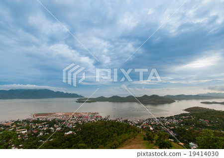 Blue clouds and sky over small village Coron at Blue clouds and sky over small village Coron at 19414030