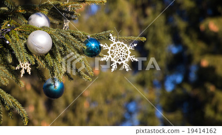 Christmas tree on blue sky background Christmas tree on blue sky background 19414162