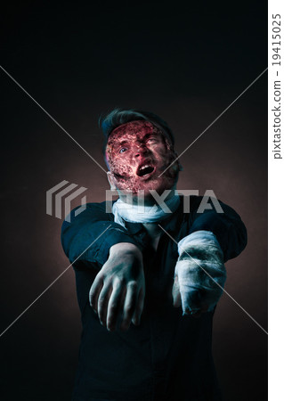 The zombie is monster in browm shirt in the studio 19415025