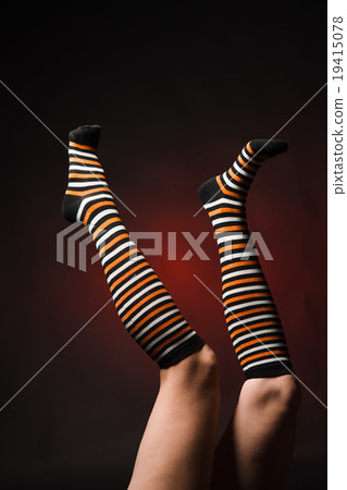 Pretty legs in  a long multi-colored socks 19415078