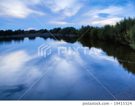 Sunrise on a Foggy Mountain Lake 19415324