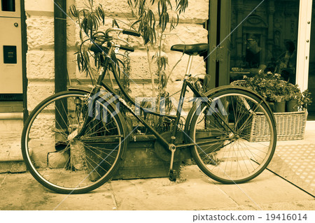 Rusty Vintage Bicycle Background in sepia color Rusty Vintage Bicycle Background in sepia color 19416014
