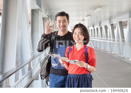 younger asian traveling man and woman younger asian traveling man and woman 19440628
