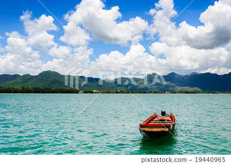 Boat on ocean with cloudy and sunny day. 19440965