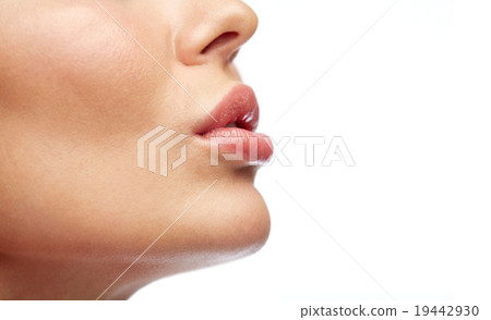 close up of young woman lips 19442930