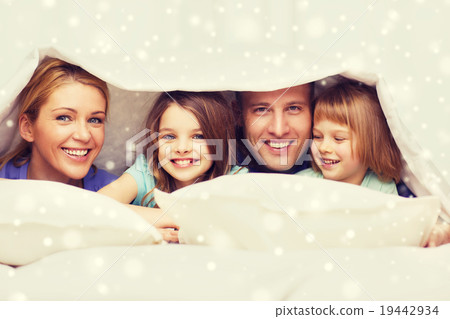 happy family with two kids under blanket at home 19442934