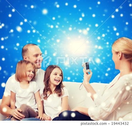 happy family with camera at home 19443432