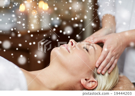 close up of woman having face massage in spa salon close up of woman having face massage in spa salon 19444203