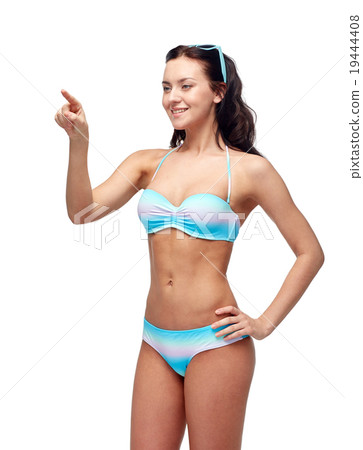 happy woman in bikini swimsuit pointing finger 19444408