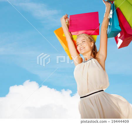 woman with shopping bags 19444409