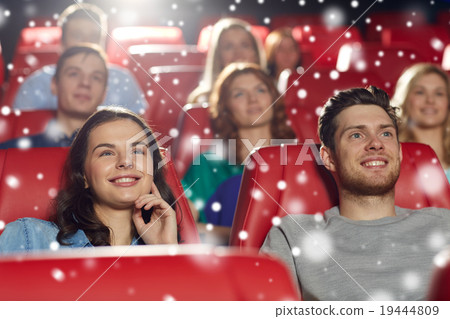 happy friends watching movie in theater 19444809