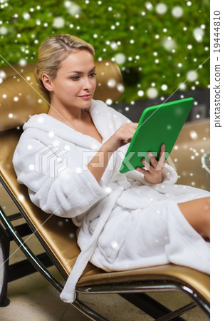 beautiful young woman with tablet pc at spa 19444810
