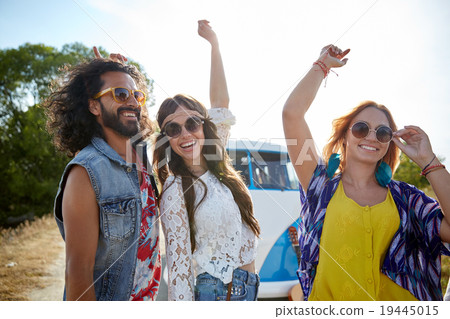 happy young hippie friends dancing outdoors happy young hippie friends dancing outdoors 19445015