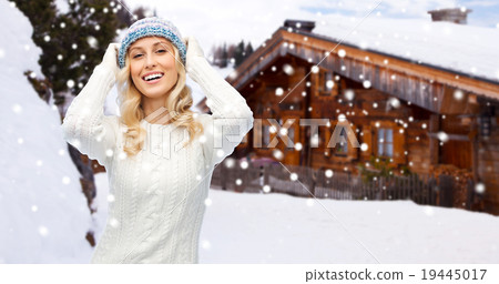 smiling young woman in winter hat and sweater smiling young woman in winter hat and sweater 19445017