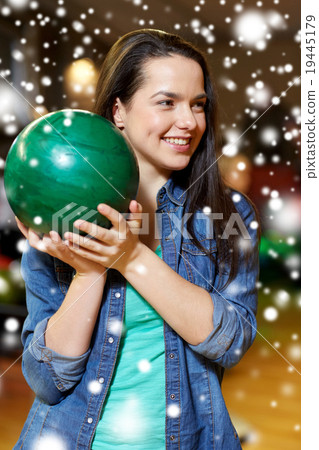 happy young woman holding ball in bowling club happy young woman holding ball in bowling club 19445179