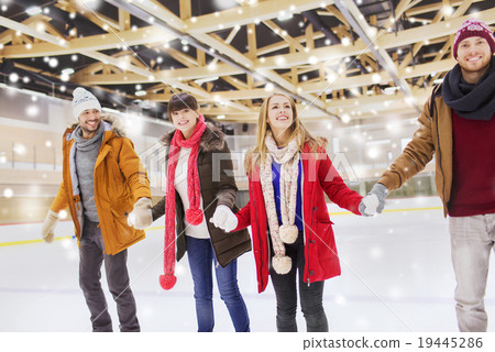 happy friends on skating rink 19445286