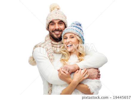 smiling couple in winter clothes hugging smiling couple in winter clothes hugging 19445657