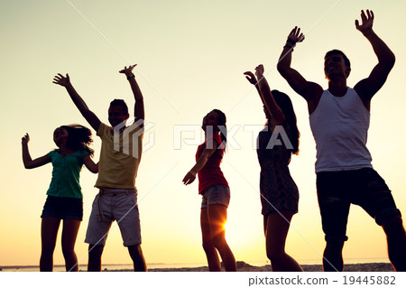 smiling friends dancing on summer beach smiling friends dancing on summer beach 19445882