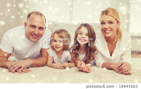 smiling parents and two little girls at home smiling parents and two little girls at home 19445883