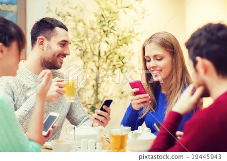 group of friends with smartphones meeting at cafe group of friends with smartphones meeting at cafe 19445943