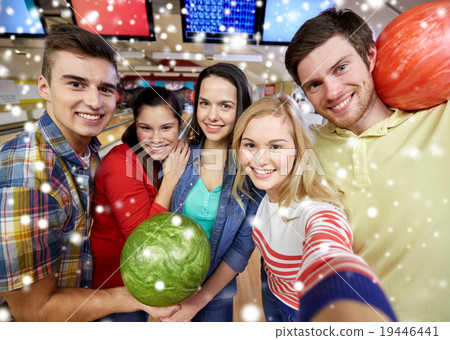 happy friends taking selfie in bowling club 19446441