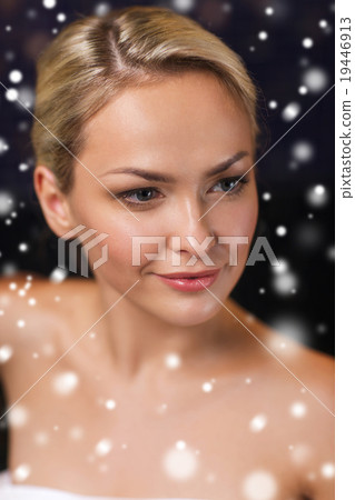 close up of young woman in bath towel at sauna 19446913