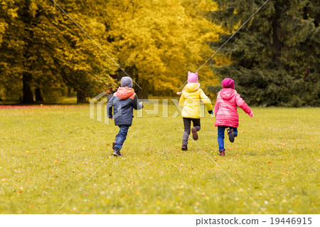 group of happy little kids running outdoors 19446915