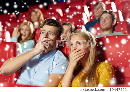 friends or couple watching horror movie in theater 19447231