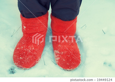 Young woman staying in the snow 19449124