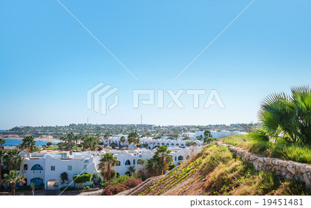 Hotel facade in Egypt With palm trees Hotel facade in Egypt With palm trees 19451481