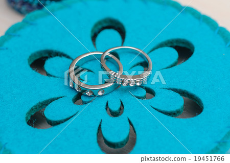 Wedding rings on a blue background 19451766